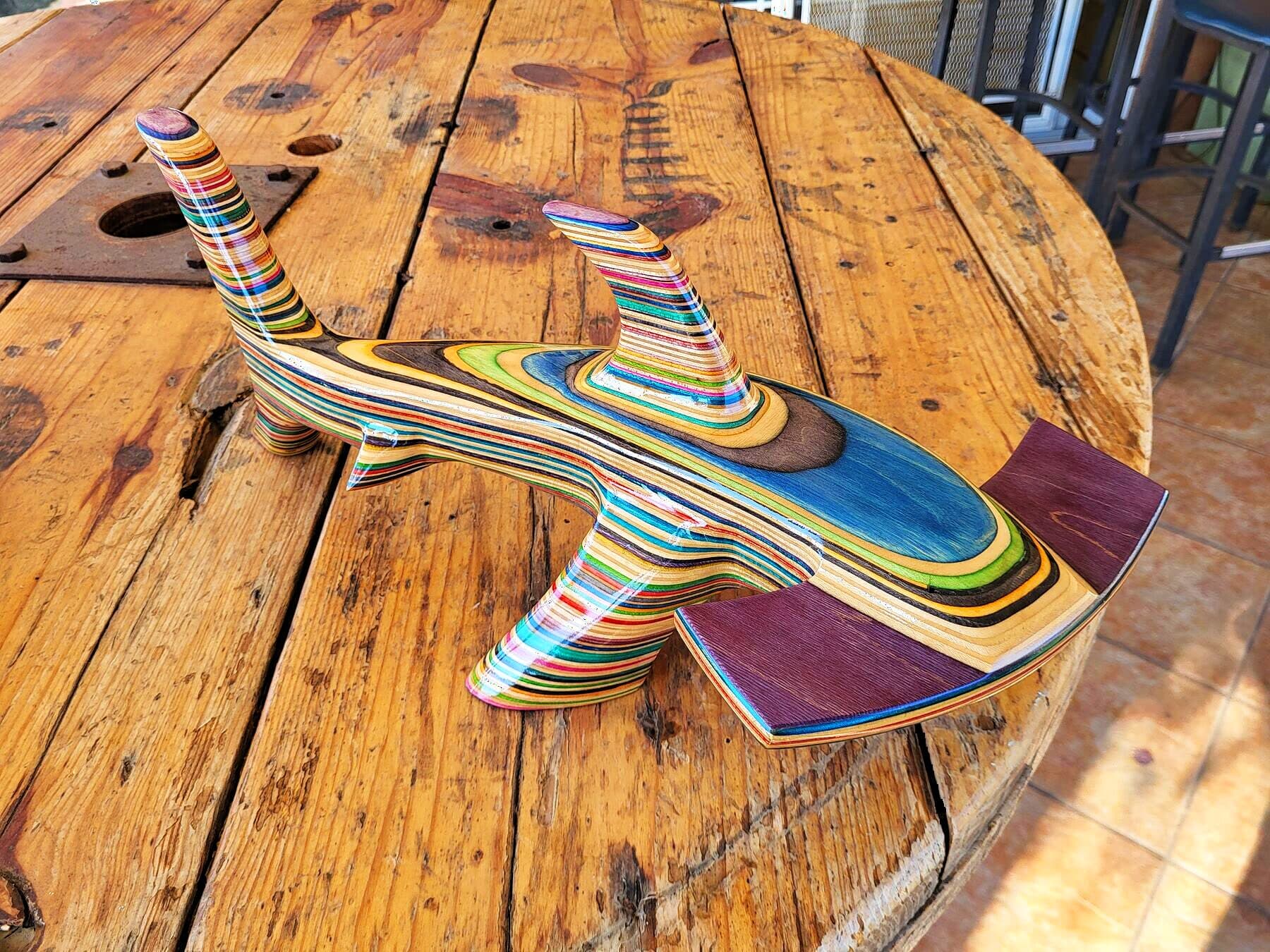 The finished Big Hammerhead carved from stacked skateboard decks